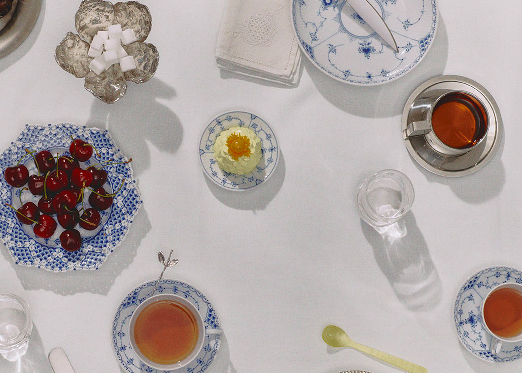 An elegant table set with Blue Fluted Half Lace and Blue Fluted Full Lace